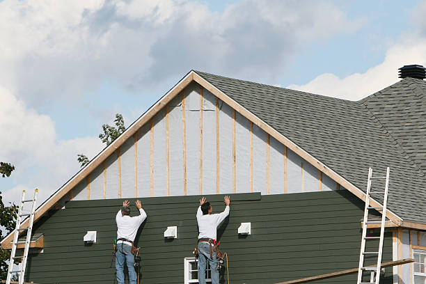 Professional Vinyl Siding technician working in Harrison, NY